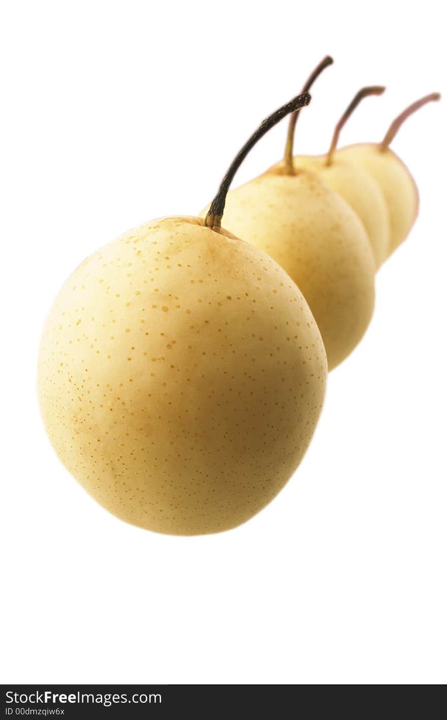 Four yellow Chinese pears on  white background