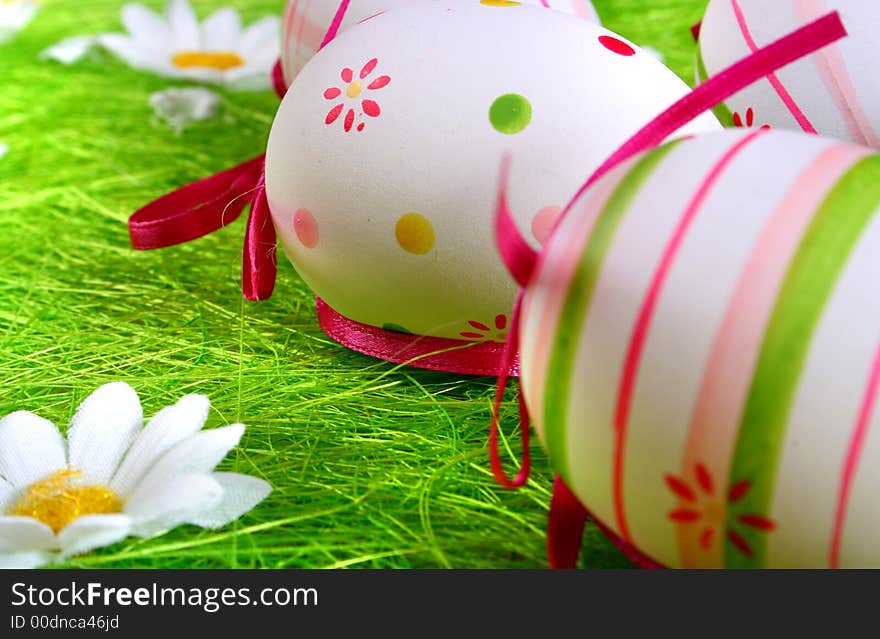 Easter eggs painted over green grass. Easter eggs painted over green grass.