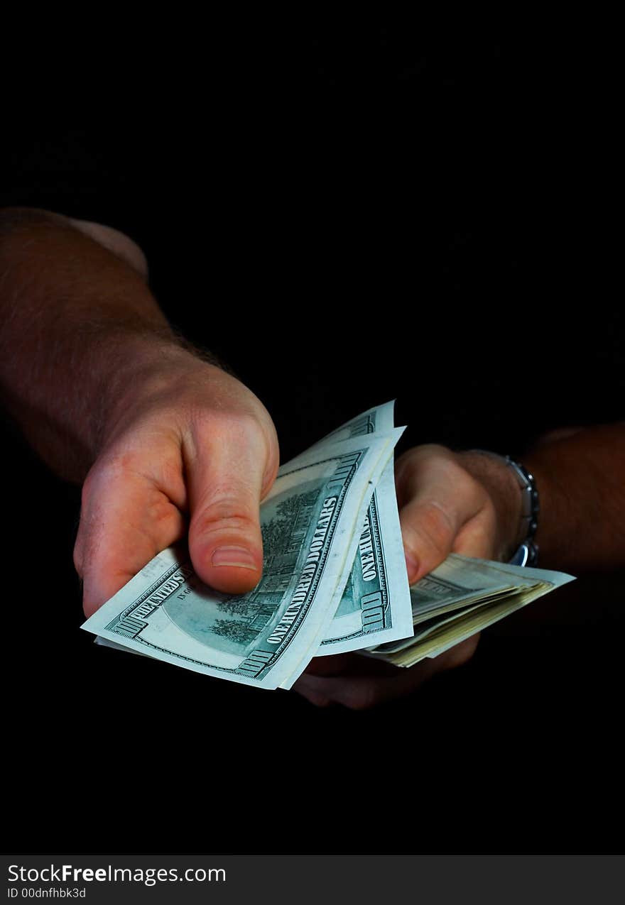 View of woman’s hand counting money in the dark. View of woman’s hand counting money in the dark