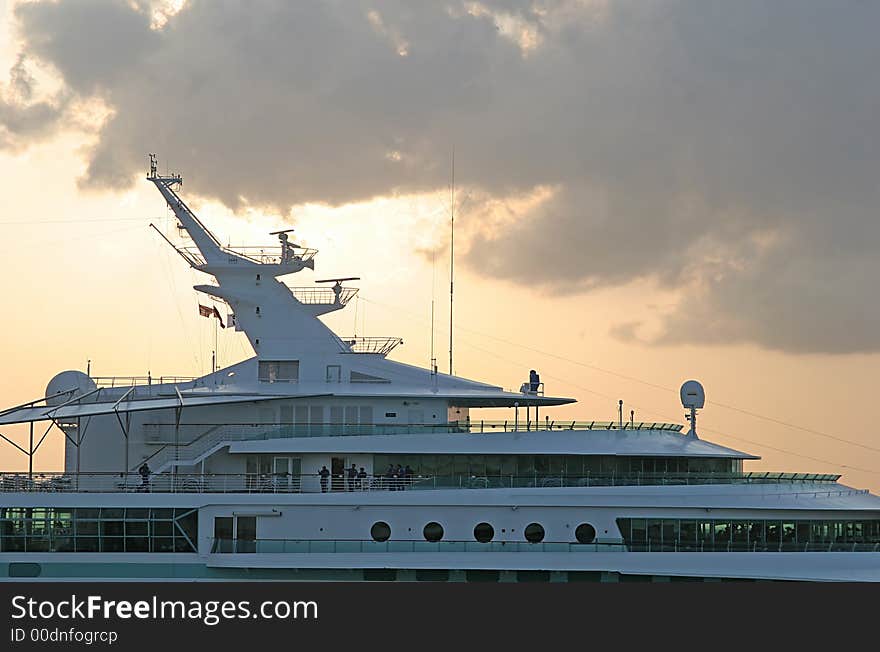 Cruise ship sillouetted against a stormy sunset. Cruise ship sillouetted against a stormy sunset