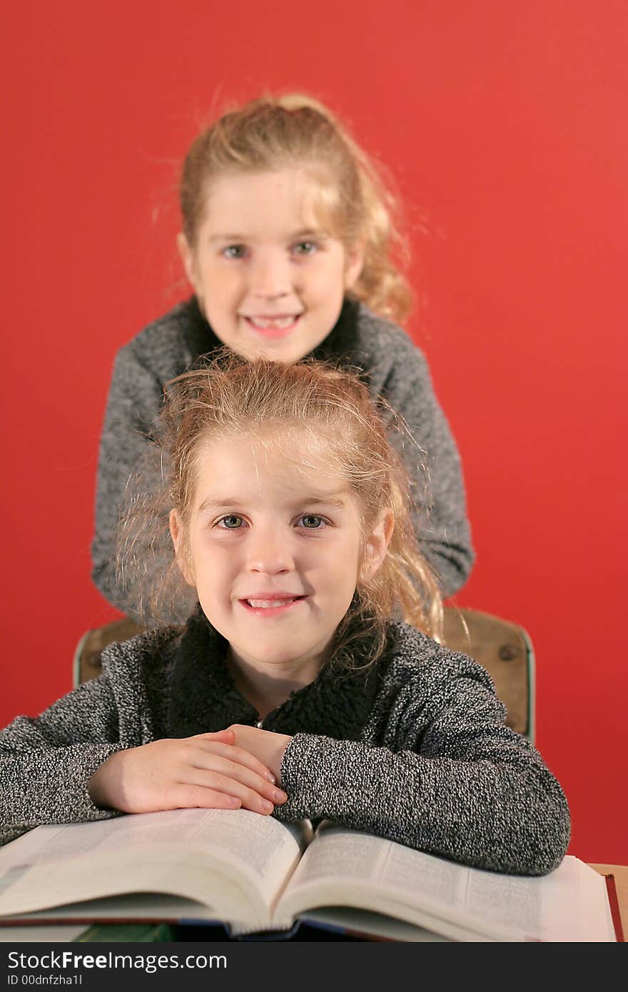 Shot of Two little girls studying together. Shot of Two little girls studying together