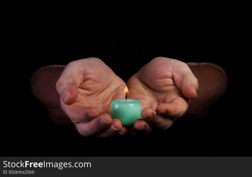 View of  hands holding candle in the dark. View of  hands holding candle in the dark