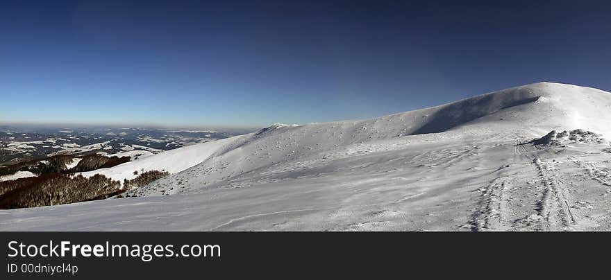 Large panoramic picture of the snowy mountainside. Large panoramic picture of the snowy mountainside