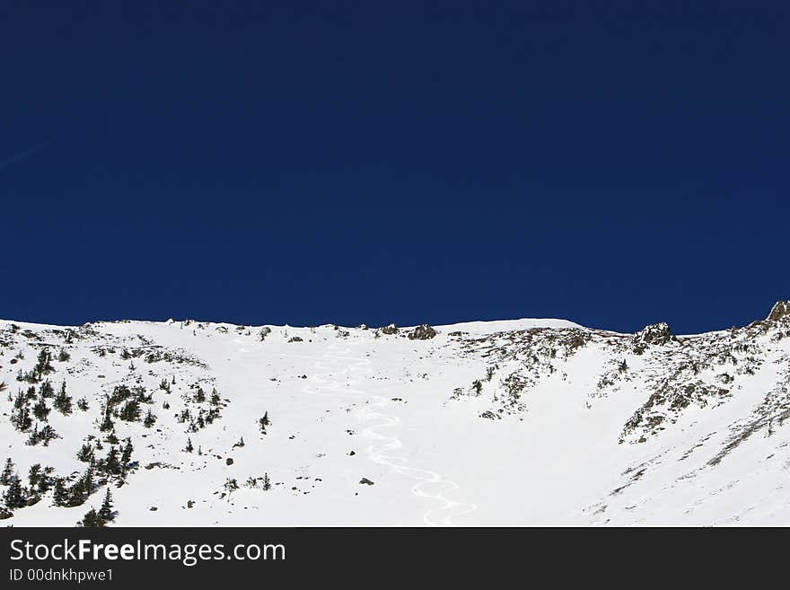 A freshly skied snow bowl on a beautiful day. A freshly skied snow bowl on a beautiful day