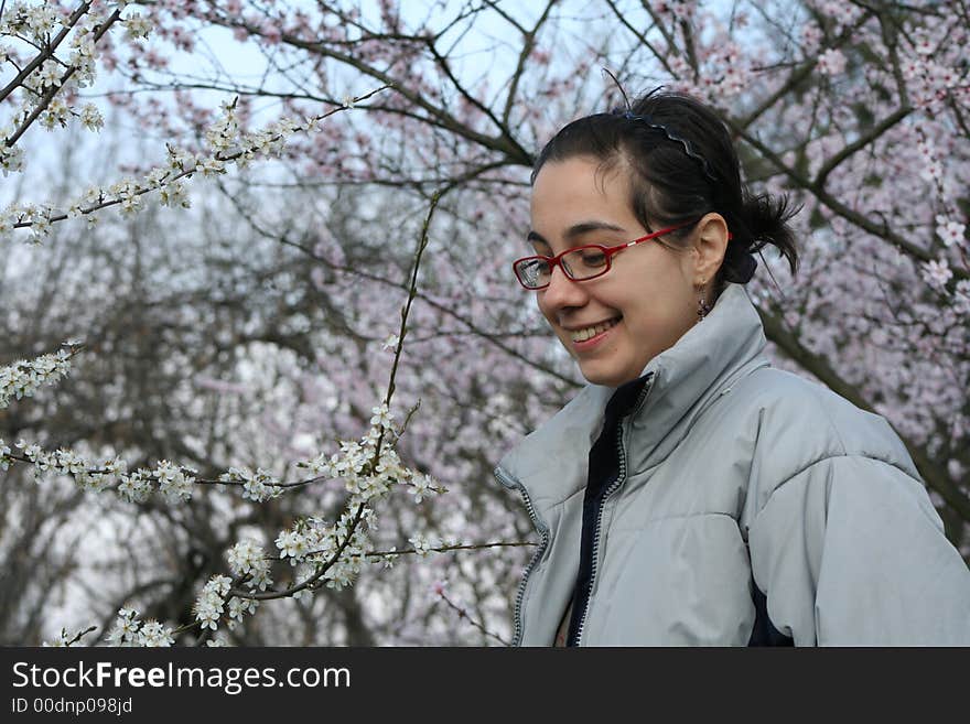 Nice girl smelling the flowers. Nice girl smelling the flowers