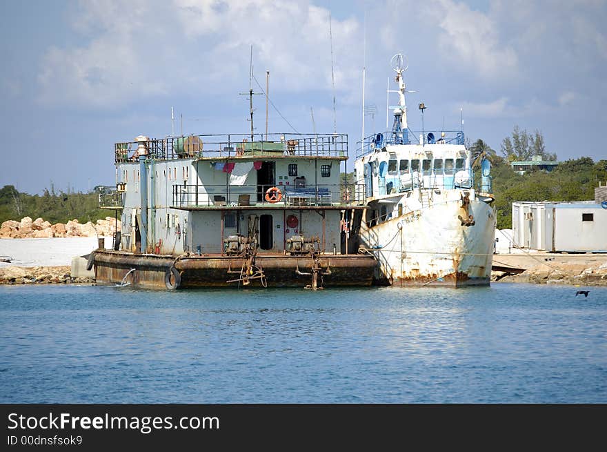 Old boats parked in the marina used as habitation