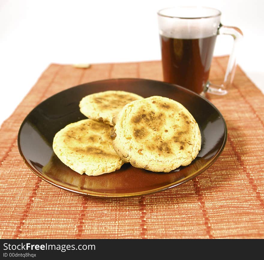 Bread served with hot tea on a plate. Bread served with hot tea on a plate