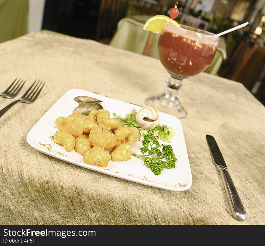 Deep fried shrimps served with a cocktail