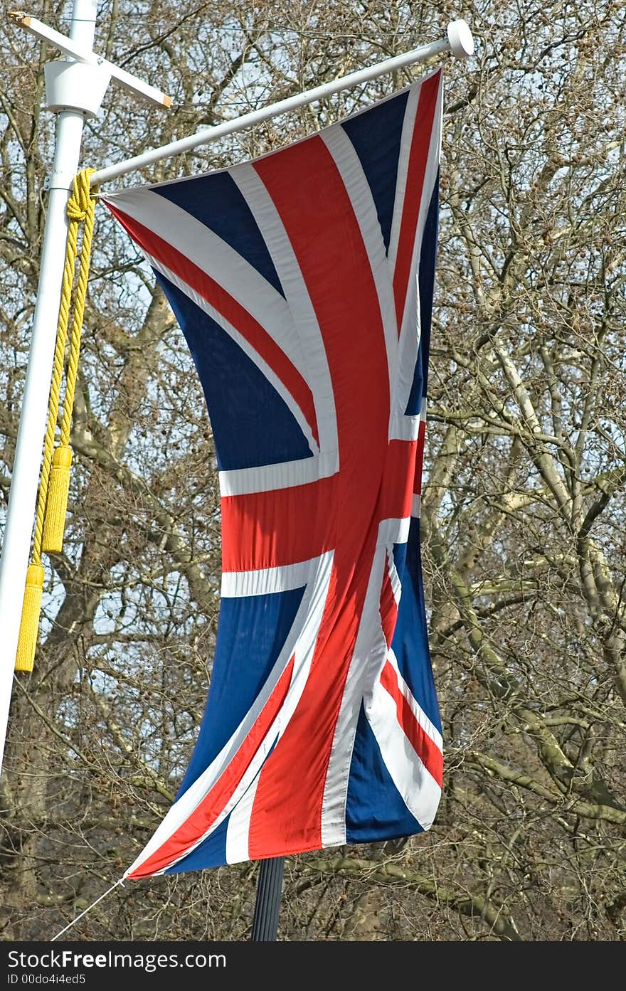 The Union Jack flapping in the breeze along the Mall, London, England.