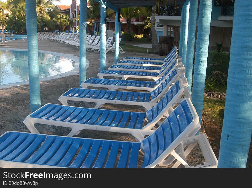 Blue and white swimming pool chairs. Blue and white swimming pool chairs