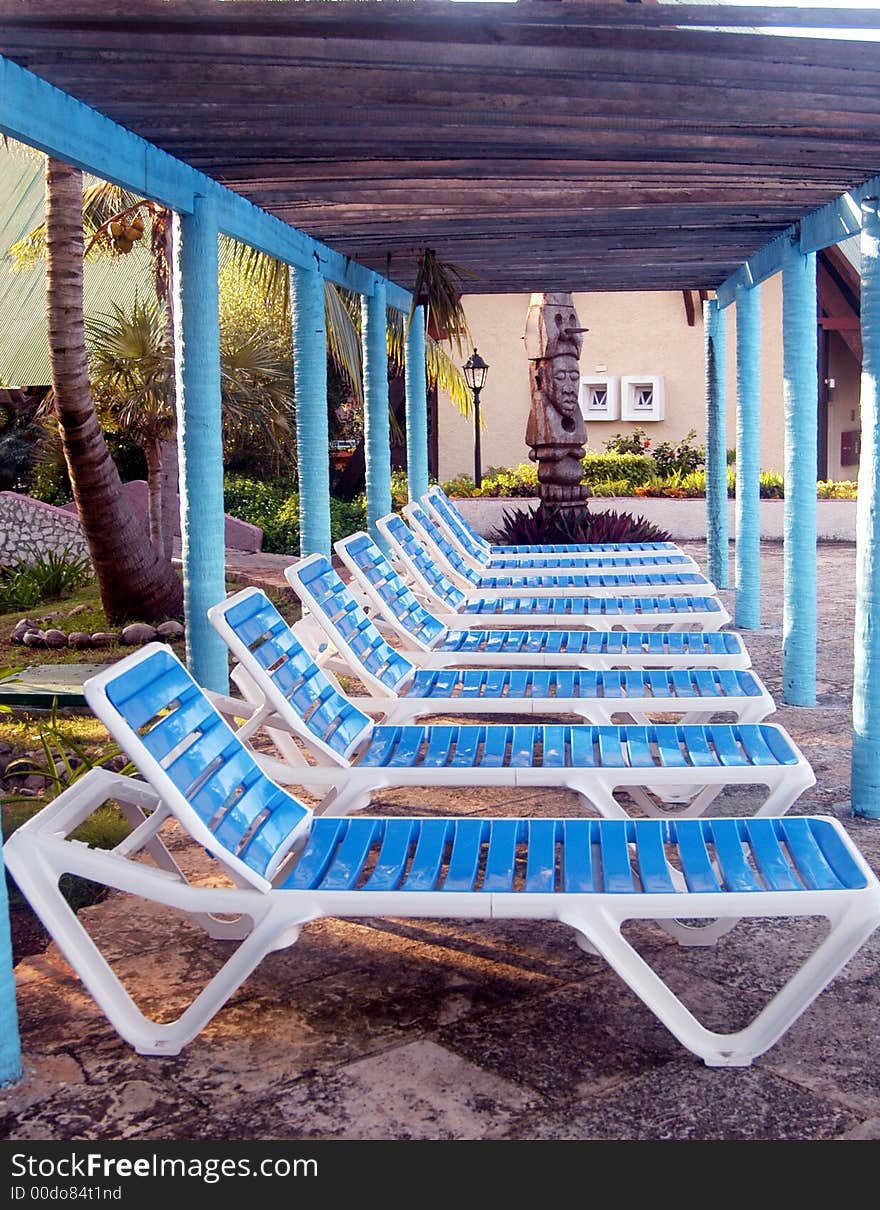 Blue and white swimming pool chairs. Blue and white swimming pool chairs