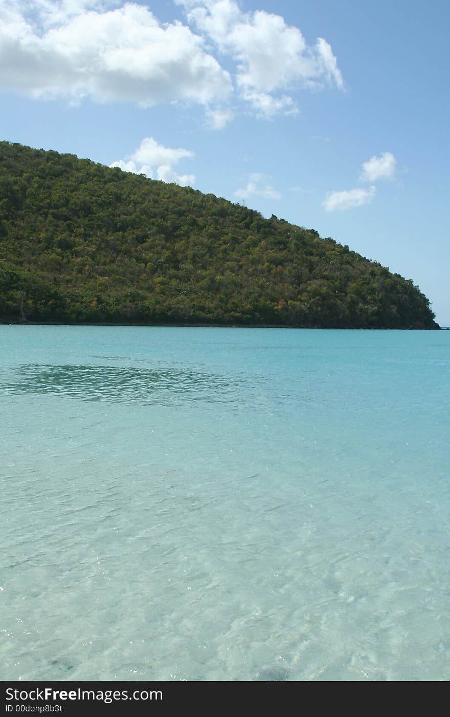 From high above, one can see the gorgeous layers of blue and green in the waters of Leinster Bay, St. John, USVI. From high above, one can see the gorgeous layers of blue and green in the waters of Leinster Bay, St. John, USVI.