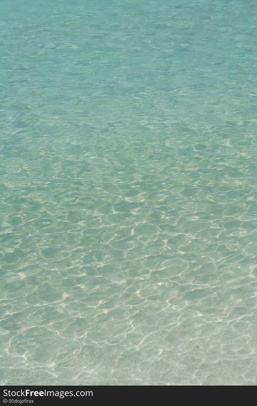 The blue-green waters of Maho Bay meet the white sand shore, on St. John in the USVI. The blue-green waters of Maho Bay meet the white sand shore, on St. John in the USVI.