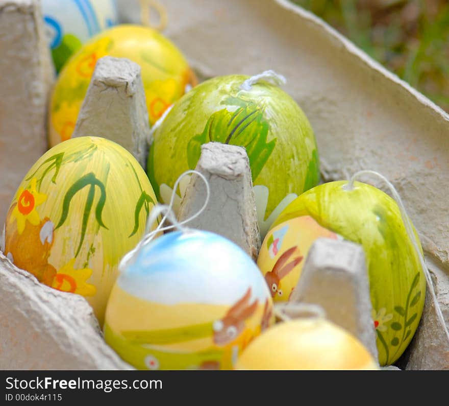 Colored and decorated Easter eggs in cardboard egg carton. Colored and decorated Easter eggs in cardboard egg carton.