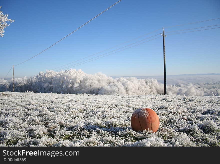 Basket ball in wintery field. Basket ball in wintery field