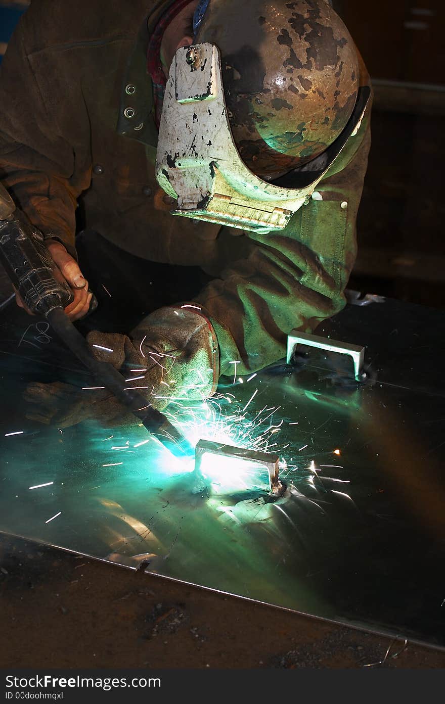 Worker welding aluminum at shipyatd. Worker welding aluminum at shipyatd