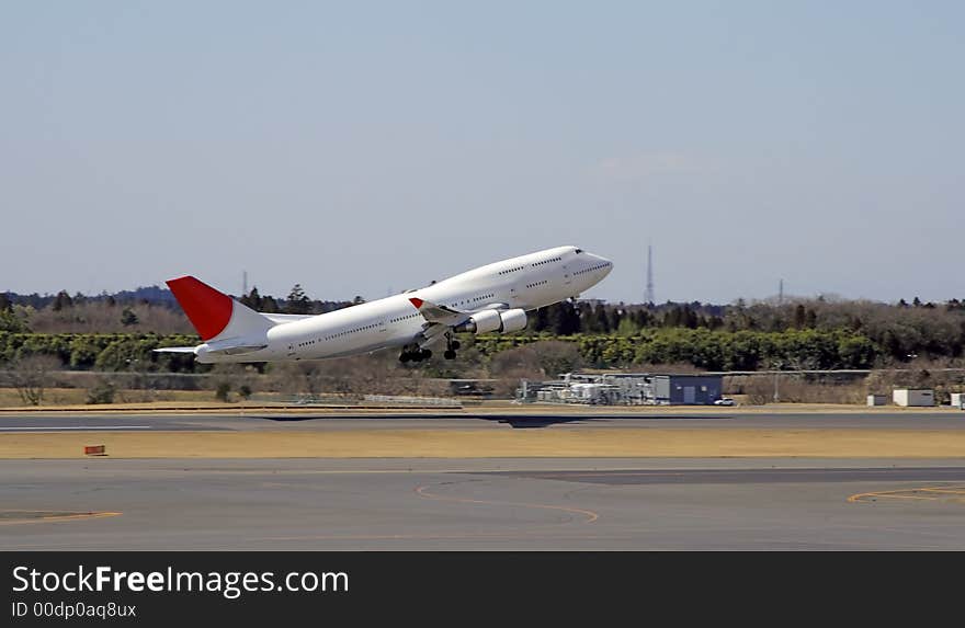 Image of an airplane taking off from an airport. Image of an airplane taking off from an airport.