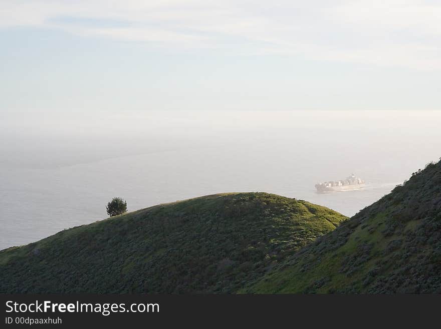 View over hills of a container ship. View over hills of a container ship