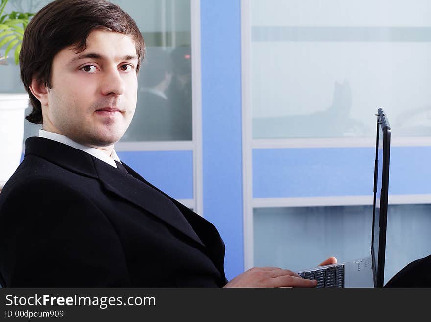 Portrait of a businessman in a working process. Portrait of a businessman in a working process