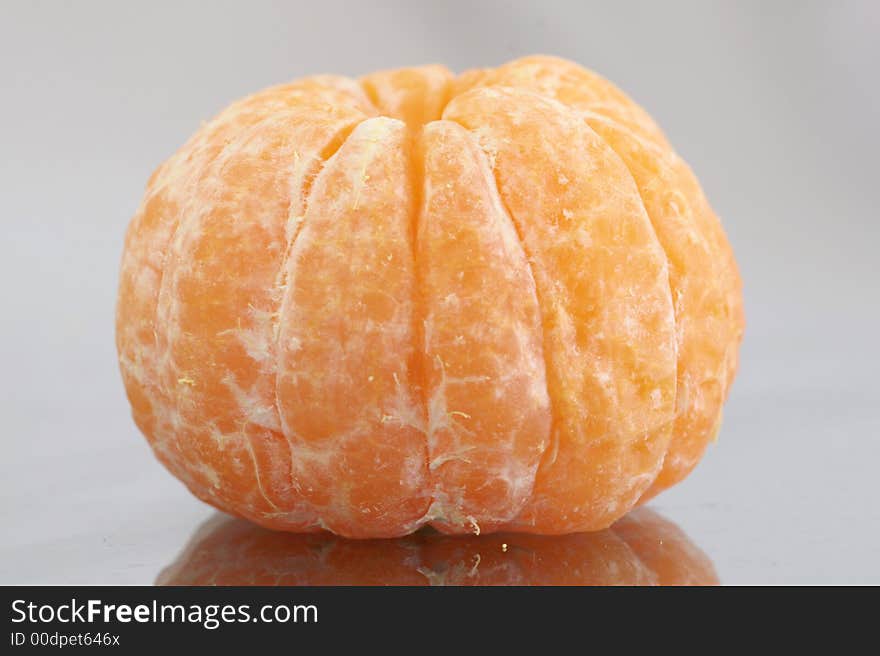 A peeled mandarin showing its wedge shaped segments. A peeled mandarin showing its wedge shaped segments