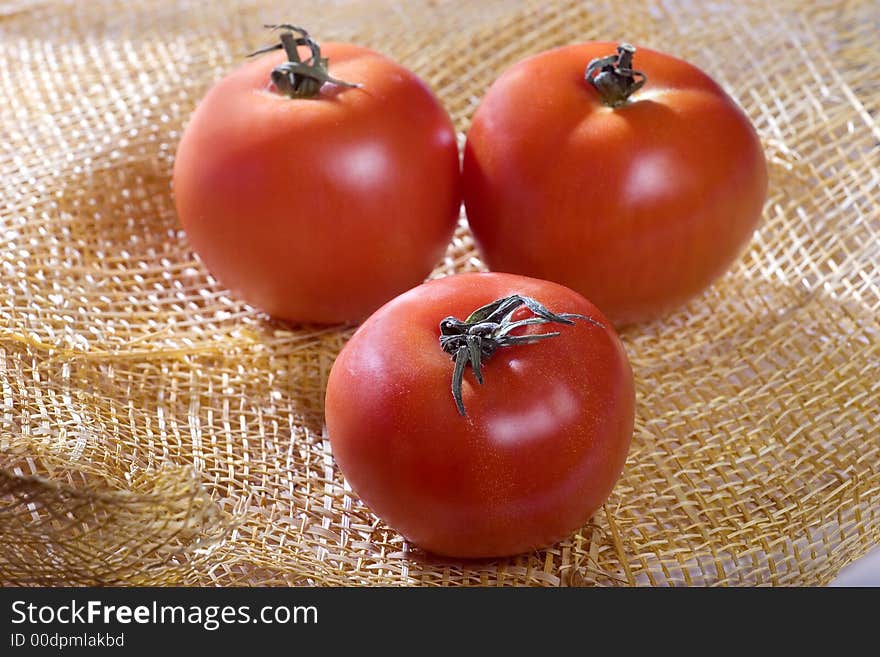 A photo of three tomatoes