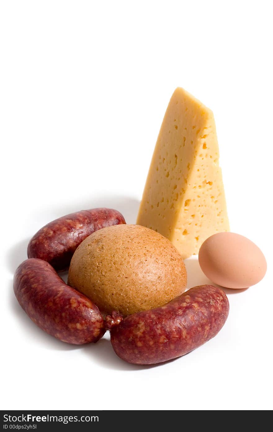 Bread, cheese, egg and sausages on white background. Bread, cheese, egg and sausages on white background