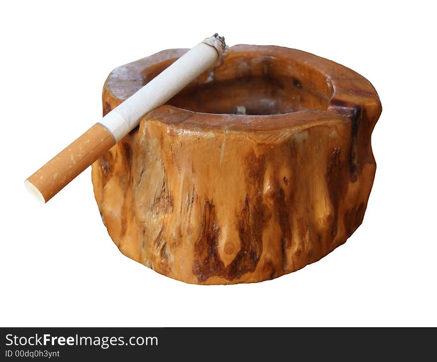 Cigarette in wooden ashtray with white backround