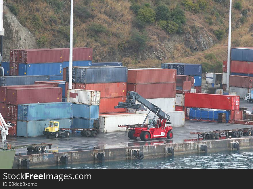 Freight containers stacked on a doc. Freight containers stacked on a doc