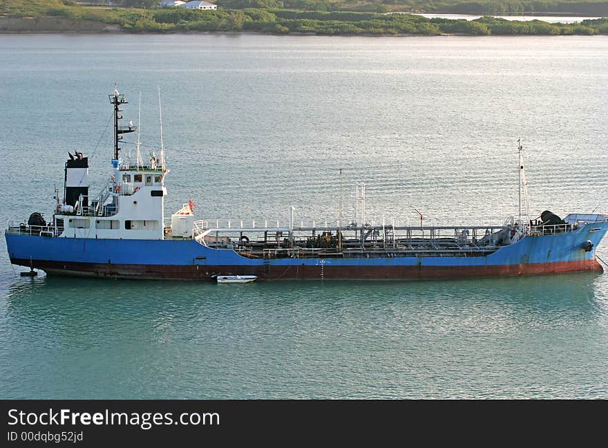 Blue Ship dredging bottom of the bay