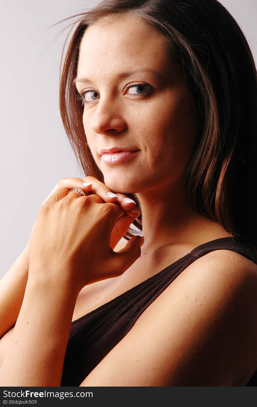 A beautiful woman praying and smiling