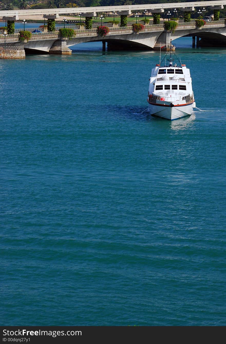 Lone ship moving towards you on a blue ocean, suggesting a holiday or a getaway. Lone ship moving towards you on a blue ocean, suggesting a holiday or a getaway