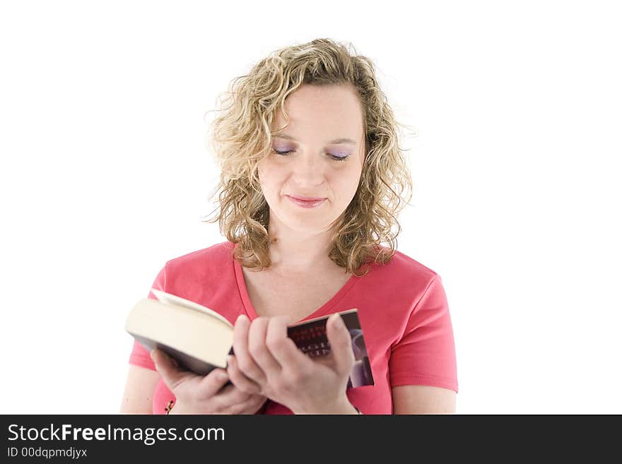 Attractive blonde reading a book isolated on white