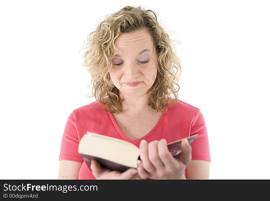 Attractive blonde reading a book isolated on white