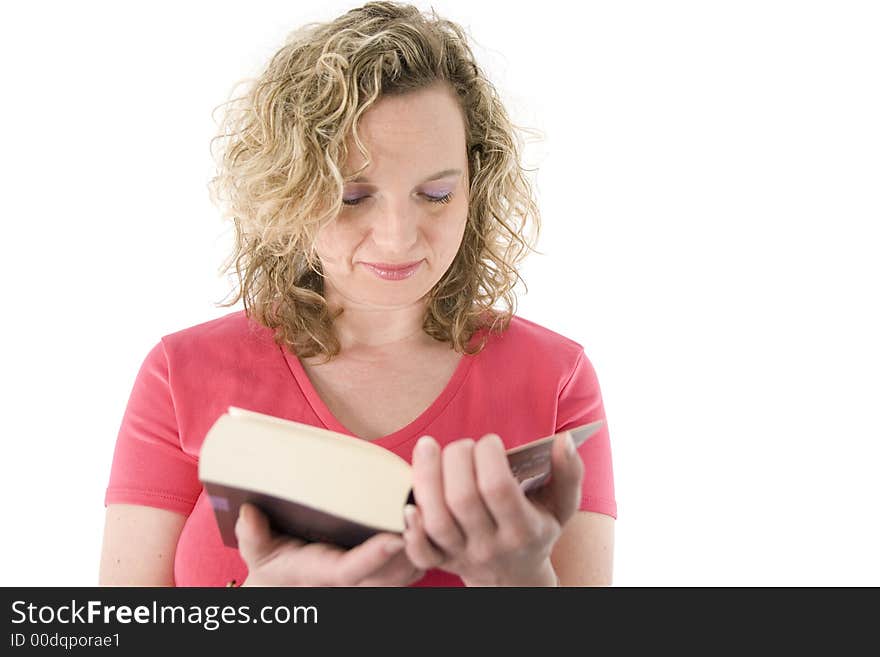 Attractive blonde reading a book isolated on white