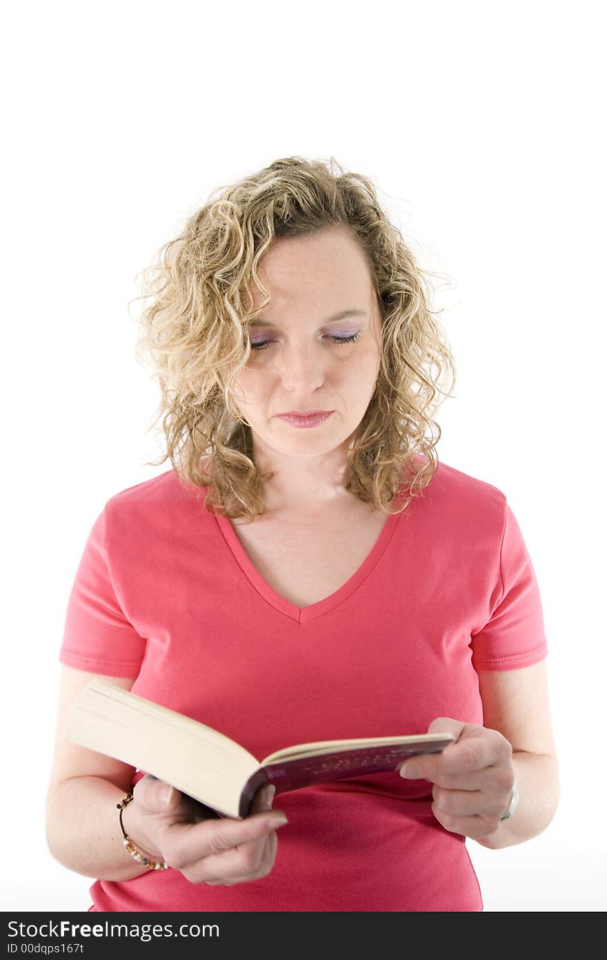 Attractive blonde reading a book isolated on white