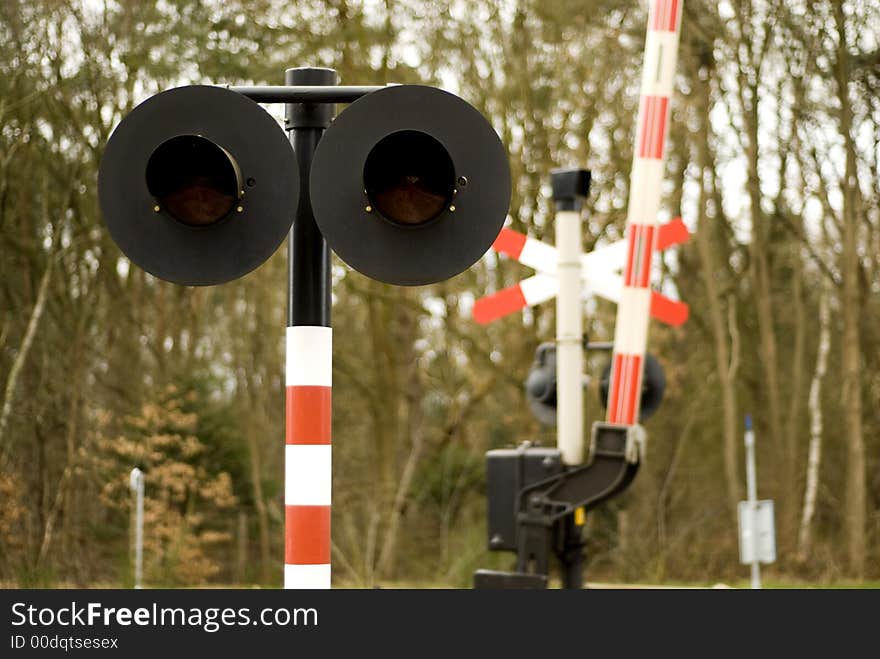 Railway-crossing attended with red lights