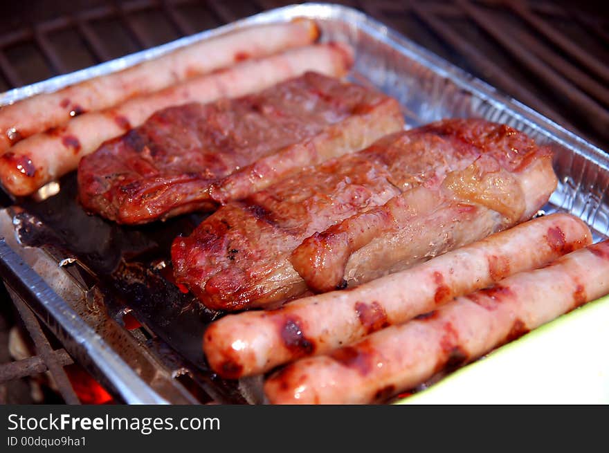 Barbecque plate with steaks and sausages. Barbecque plate with steaks and sausages