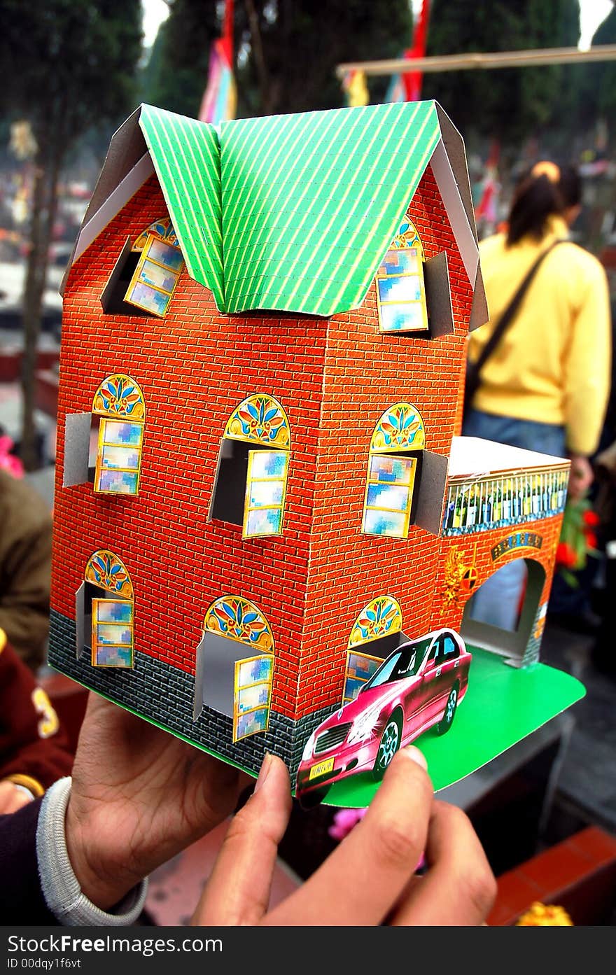 Paper house   in a traditional cemetery in Sichuan,west of China.Chinese paper house used as cherish the memory of the dead in spring annually. Paper house   in a traditional cemetery in Sichuan,west of China.Chinese paper house used as cherish the memory of the dead in spring annually.