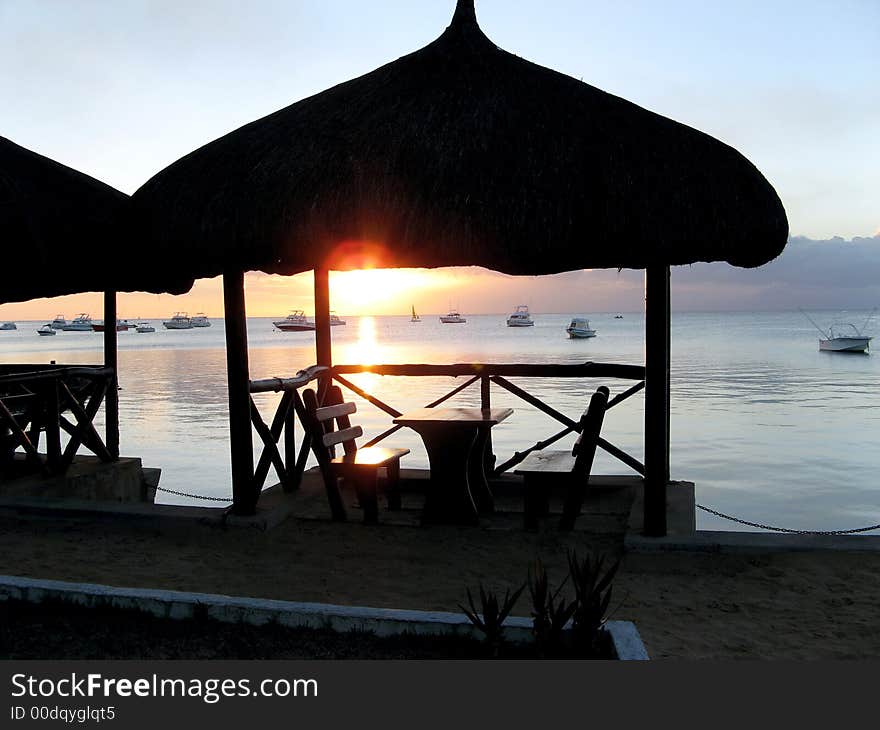 Boats on the sea and the sun setting. Boats on the sea and the sun setting