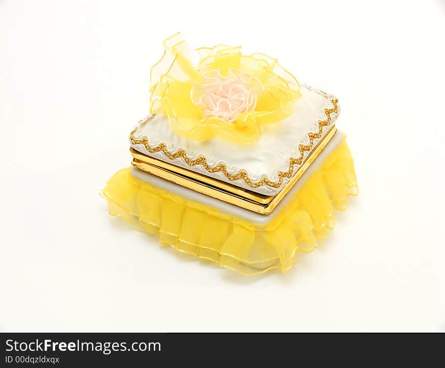 Yellow casket for storage of ornaments and jewelry