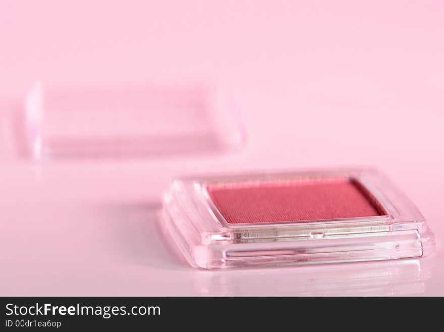 Cosmetic product close-up with pink cast. Cosmetic product close-up with pink cast