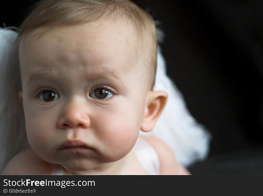 Image of baby wearing angel wings. Image of baby wearing angel wings