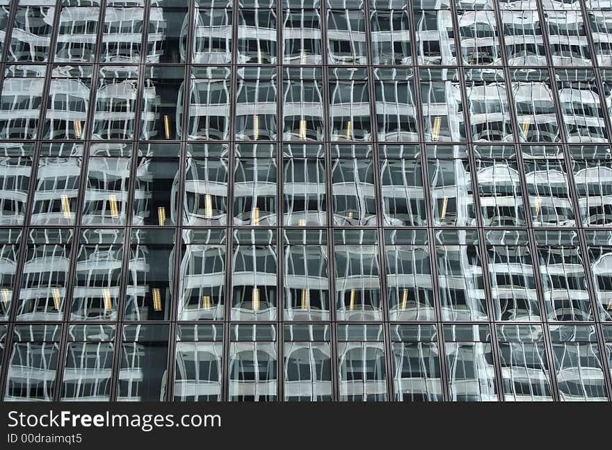 Abstract reflections in the windows of a corporate building.