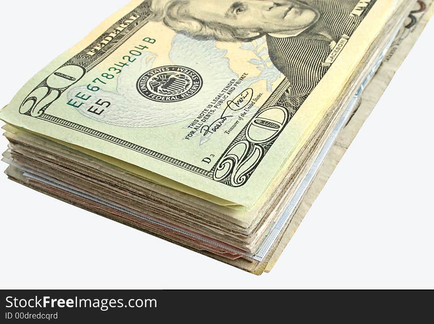 A wad of American dollars isolated on a white background. A wad of American dollars isolated on a white background