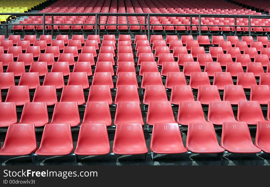 Many Empty Seats In Rows In An Outdoor Stadium. Many Empty Seats In Rows In An Outdoor Stadium