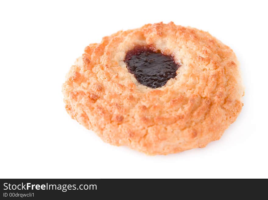 A cookie with jam on a white background