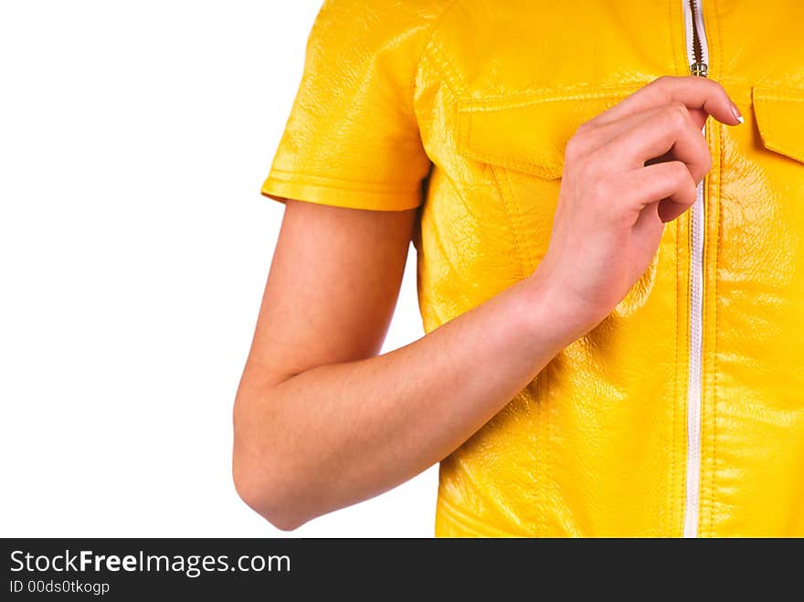 Girl removes a yellow blouse on a white background