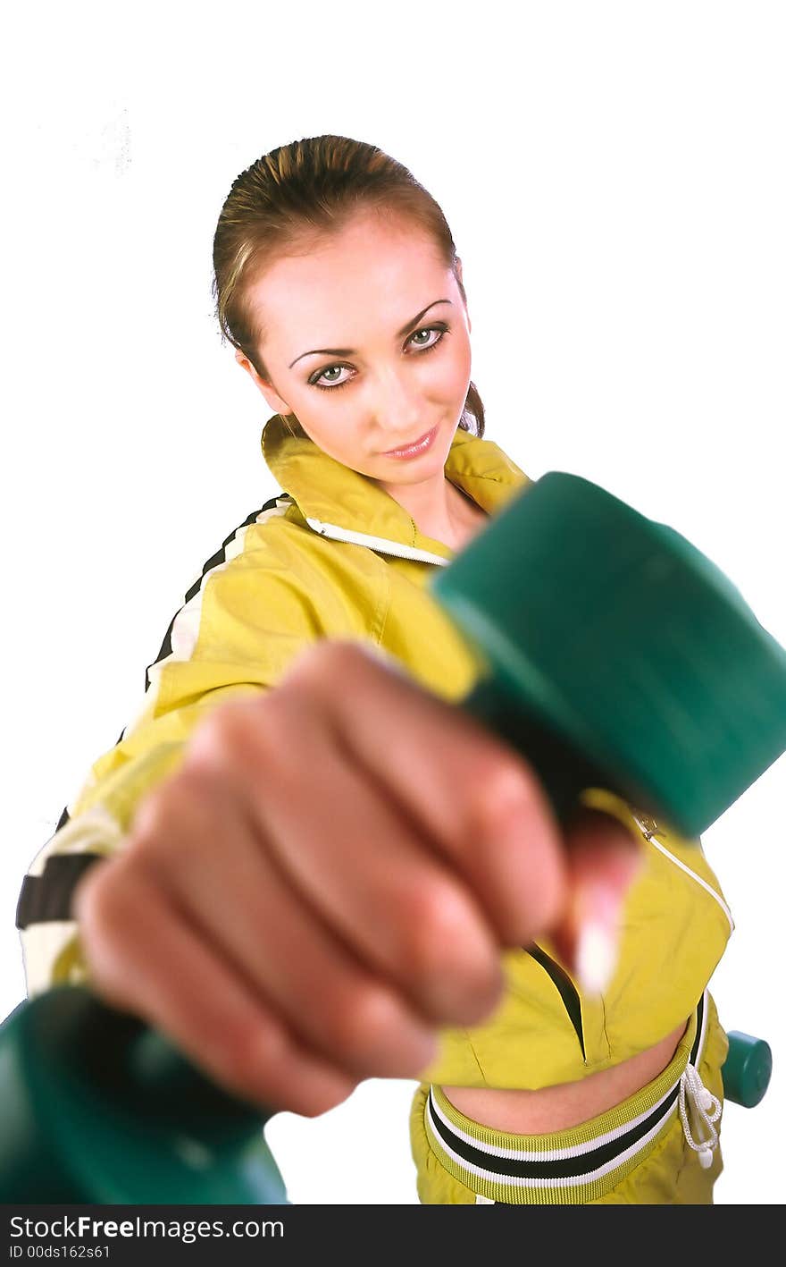 Girl in an olive sports suit threatens dumbbells