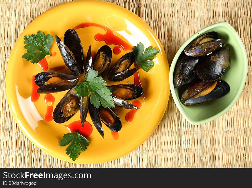 Tasty oven shellfish served in the yellow plate