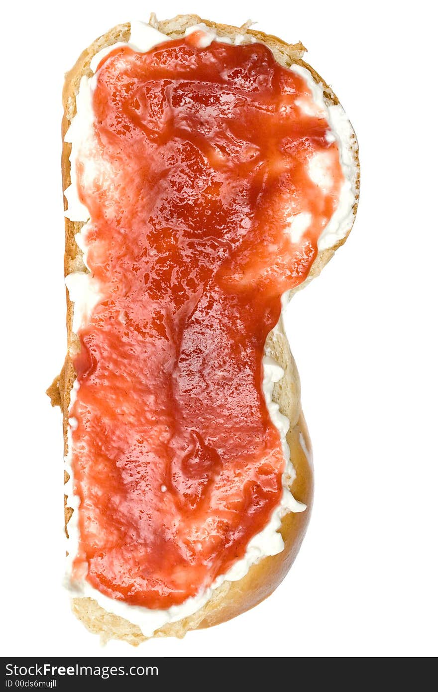 Butter and raspberry jam on a slice of bread. Isolated on a white background. Butter and raspberry jam on a slice of bread. Isolated on a white background.